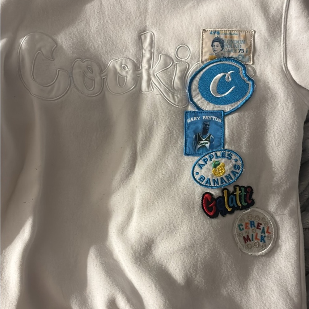 White Sweatshirt with Colorful Patches